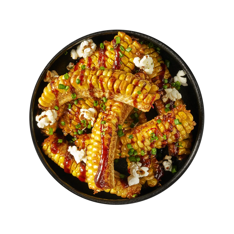 Grilled corn ribs with sauce and popcorn